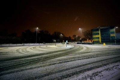 View of city street during winter at night