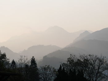 Scenic view of silhouette mountains against sky during sunset