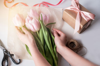 High angle view of woman holding white flower bouquet