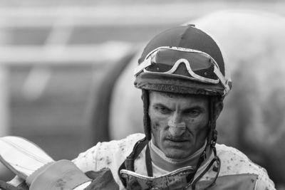 Messy sportsman wearing helmet