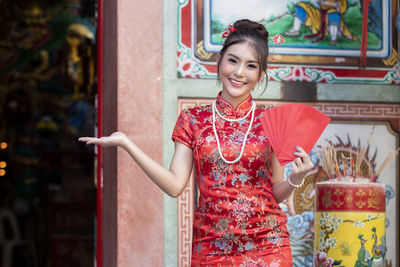 Portrait of smiling young woman in traditional clothing