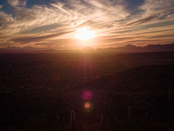 Scenic view of mountains against sky at sunset