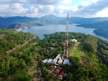 High angle view of lake and buildings against sky