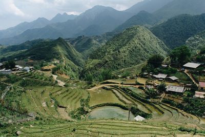 High angle view of agricultural field and mountains