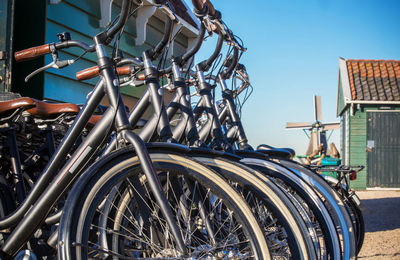 Bicycles parked in city against sky