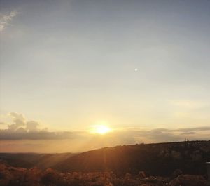 Scenic view of landscape against sky during sunset