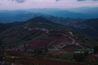 High angle view of buildings and mountains against sky