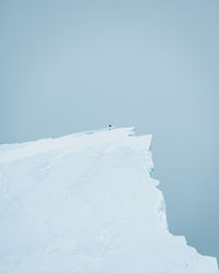 Snow covered mountain against clear sky