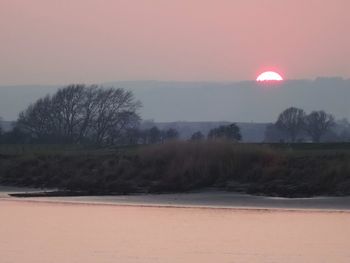 Scenic view of landscape against sky during sunset