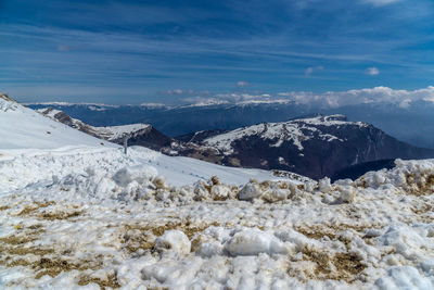 Scenic view of snowcapped mountains against sky