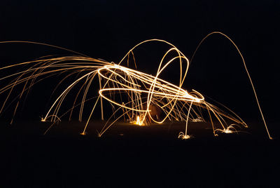 Light trails against sky at night