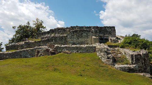 Old ruin building against cloudy sky