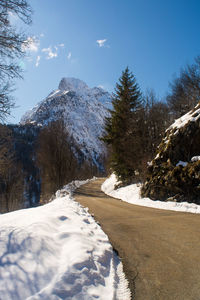 Scenic view of snow covered mountains against sky