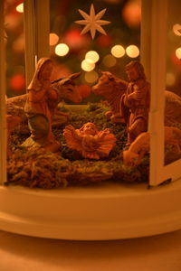 Close-up of illuminated christmas lights on table