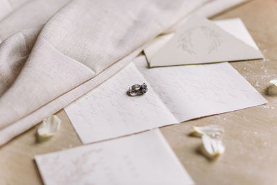 High angle view of wedding rings on table