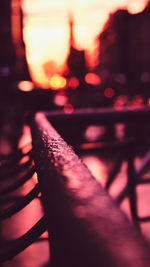 Close-up of illuminated railing on table at night