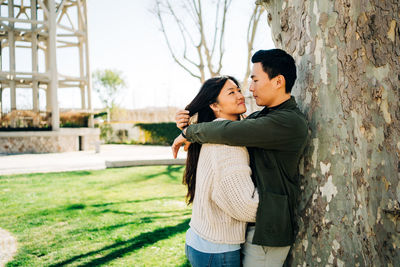 Side view of a young couple kissing