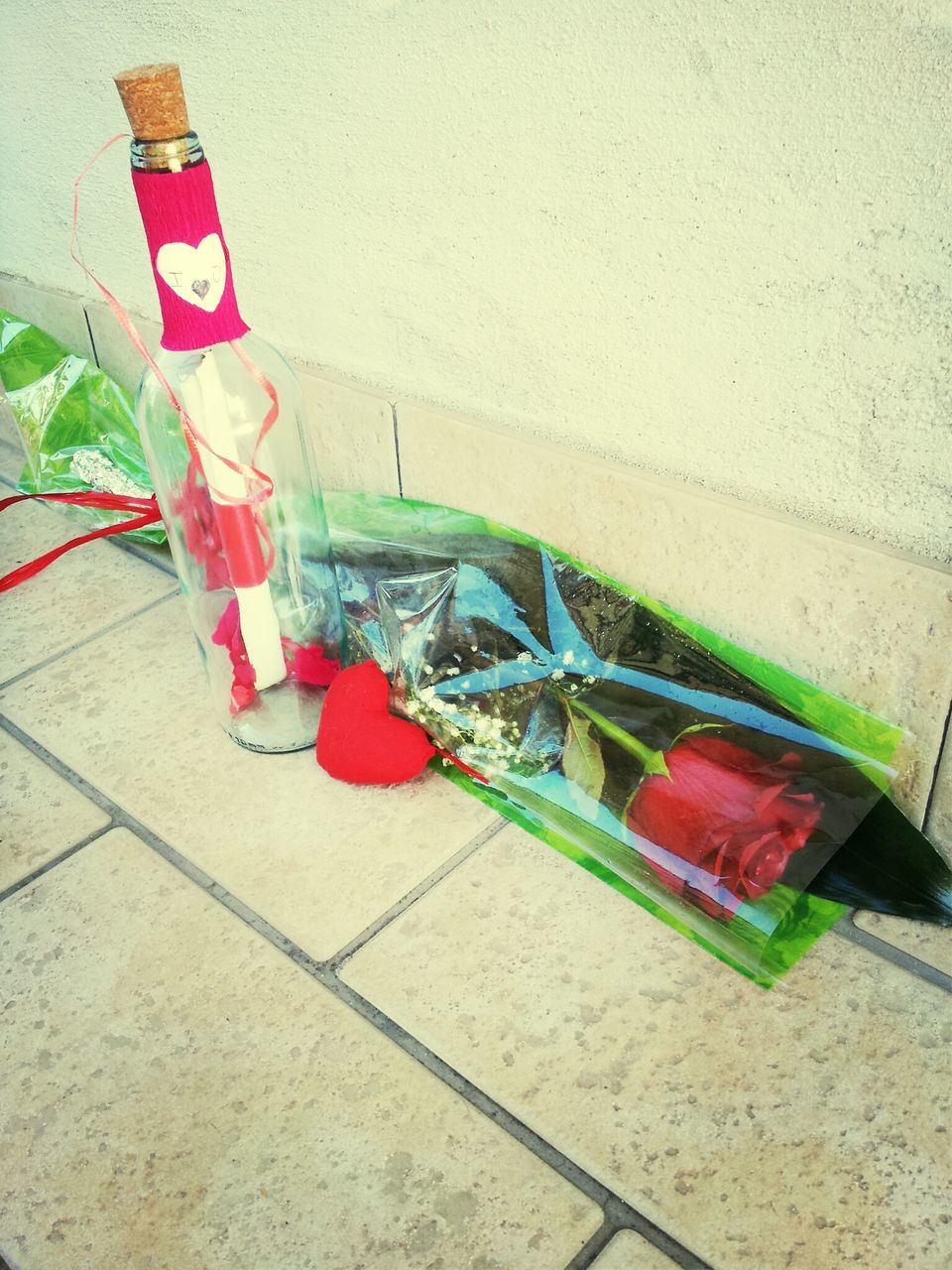 table, red, still life, indoors, wall - building feature, high angle view, no people, empty, multi colored, absence, chair, day, built structure, close-up, variation, glass - material, group of objects, wall, sunlight, architecture