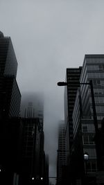 Low angle view of modern buildings against clear sky