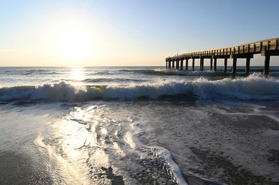 Scenic view of sea against clear sky during sunset