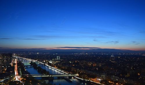 Aerial view of illuminated cityscape at night