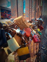 Close-up of padlocks hanging on railing