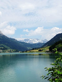 Scenic view of lake and mountains against sky