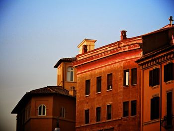 Low angle view of building against clear blue sky