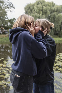 Two teenage girls kissing