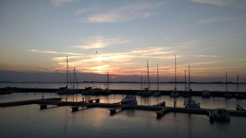 High angle view of boats moored on river at sunset