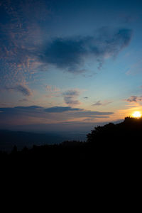 Scenic view of silhouette landscape against sky during sunset