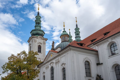 Low angle view of cathedral against cloudy sky