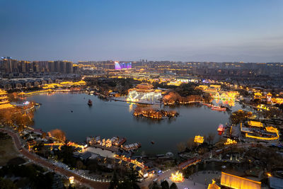 High angle view of illuminated buildings in city