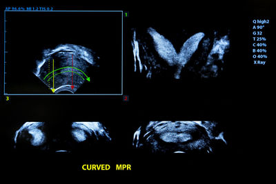 Digital composite image of light painting against black background