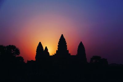 Silhouette of temple against sky during sunset