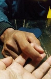 Midsection of person holding hands