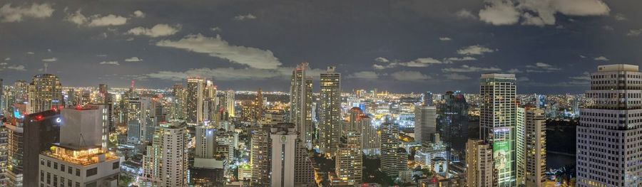 Aerial view of modern buildings in city against sky