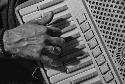 High angle view of person playing piano