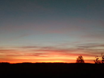 Scenic view of silhouette landscape against sky during sunset