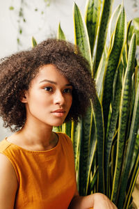 Portrait of woman against plants