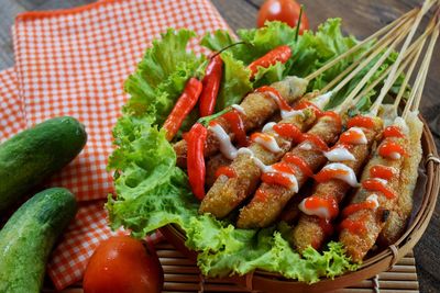 Chicken meatball satay on wooden table