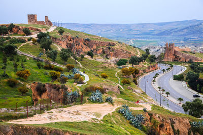 High angle view of road by mountain against sky