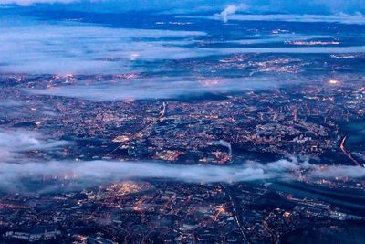High angle view of illuminated cityscape against sky