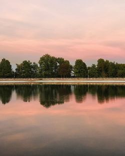 Scenic view of calm lake at sunset