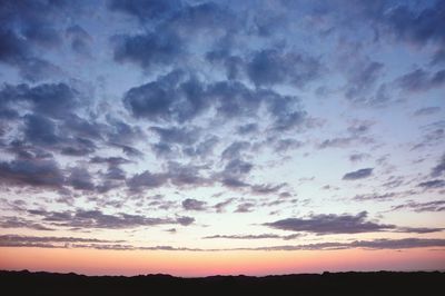 Low angle view of dramatic sky during sunset