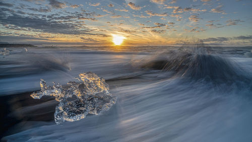 Scenic view of sea against sky during sunset