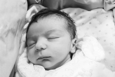 Cute baby sleeping on bed