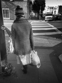 Rear view of man on the ground