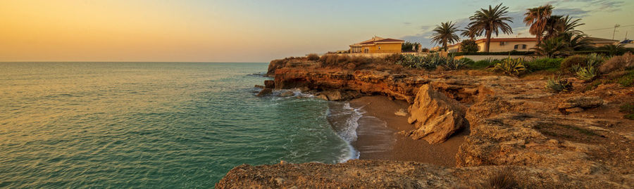 Scenic view of sea against sky at sunset