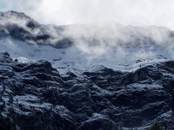 Scenic view of volcanic mountain range against sky